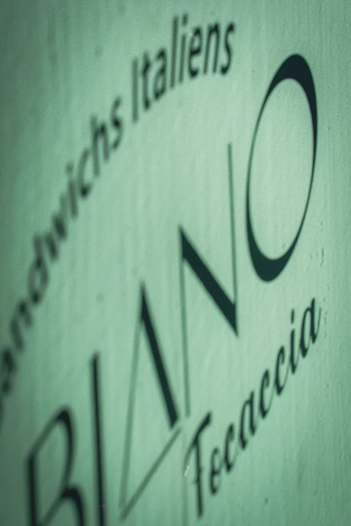 The Fabiano Focaccia signature on the green wall